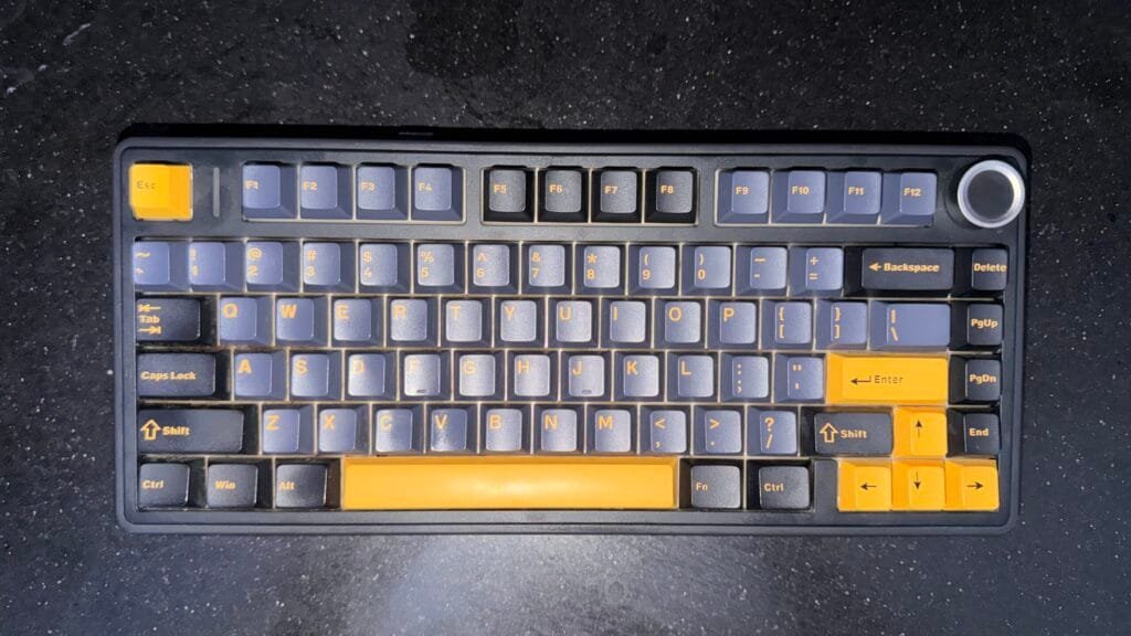 My Aula F75 keyboard in the black and yellow colorway with a compact 75% layout, rotary knob, and PBT keycaps.