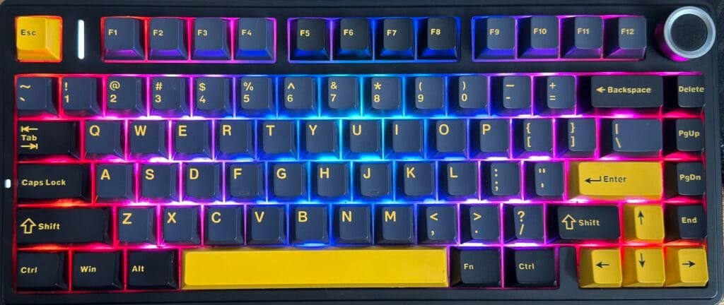 My Aula F75 keyboard in the black and yellow colorway with a compact 75% layout, rotary knob, and PBT keycaps.